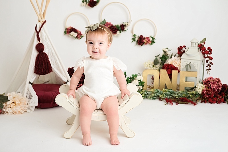 red and gold girl first birthday session