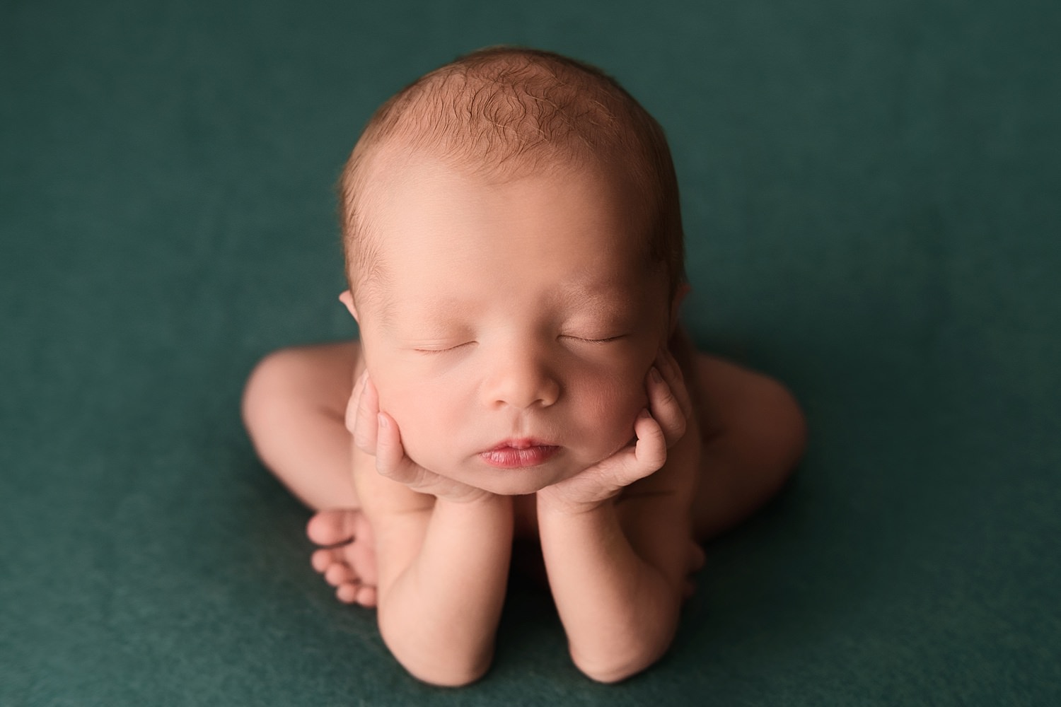 metro detroit newborn photographer newborn boy on teal fabric backdrop