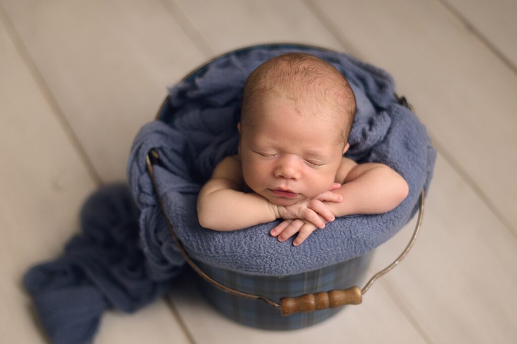 baby boy in bucket pose blue