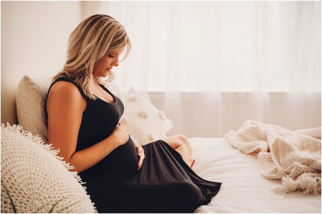mini maternity pregnant mom in black dress