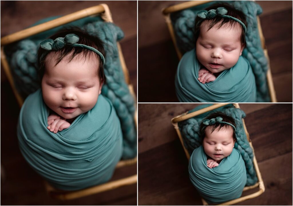 newborn girl in basket teal wrap and headband