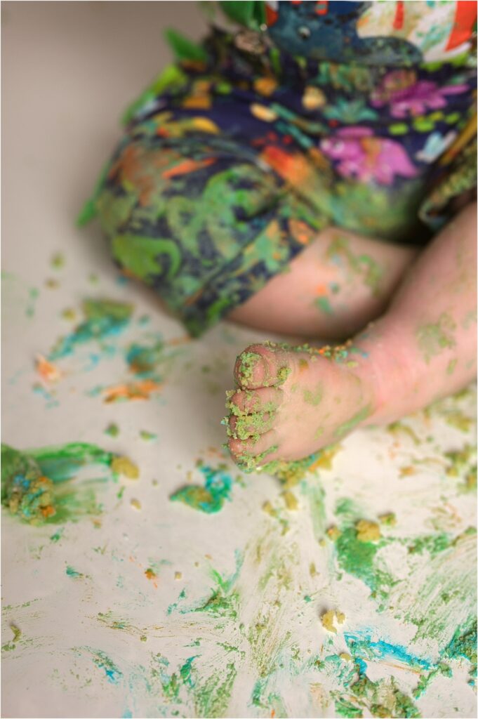 toes with cake smashed in them