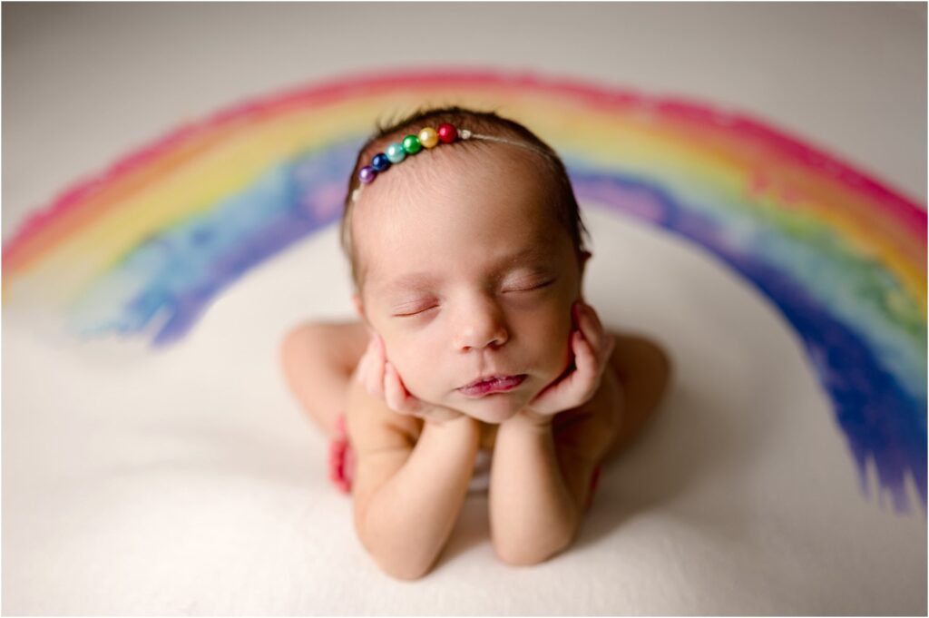 Fraser Newborn on rainbow backdrop