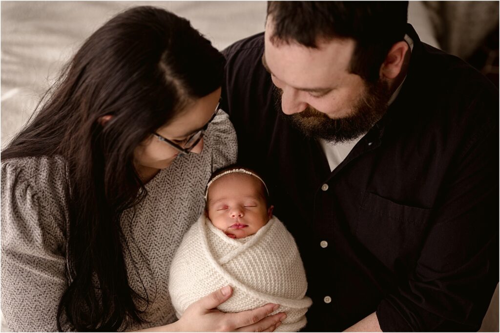 Fraser Newborn baby girl wrapped with parents